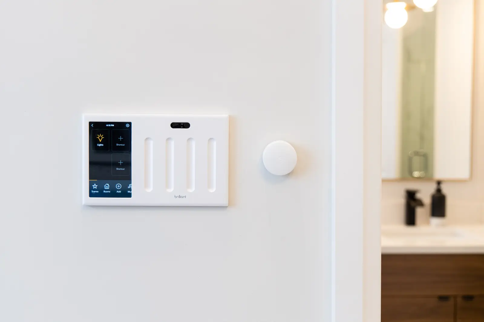Wall control panel beside the walnut vanity in a Richmond Hill townhouse bathroom