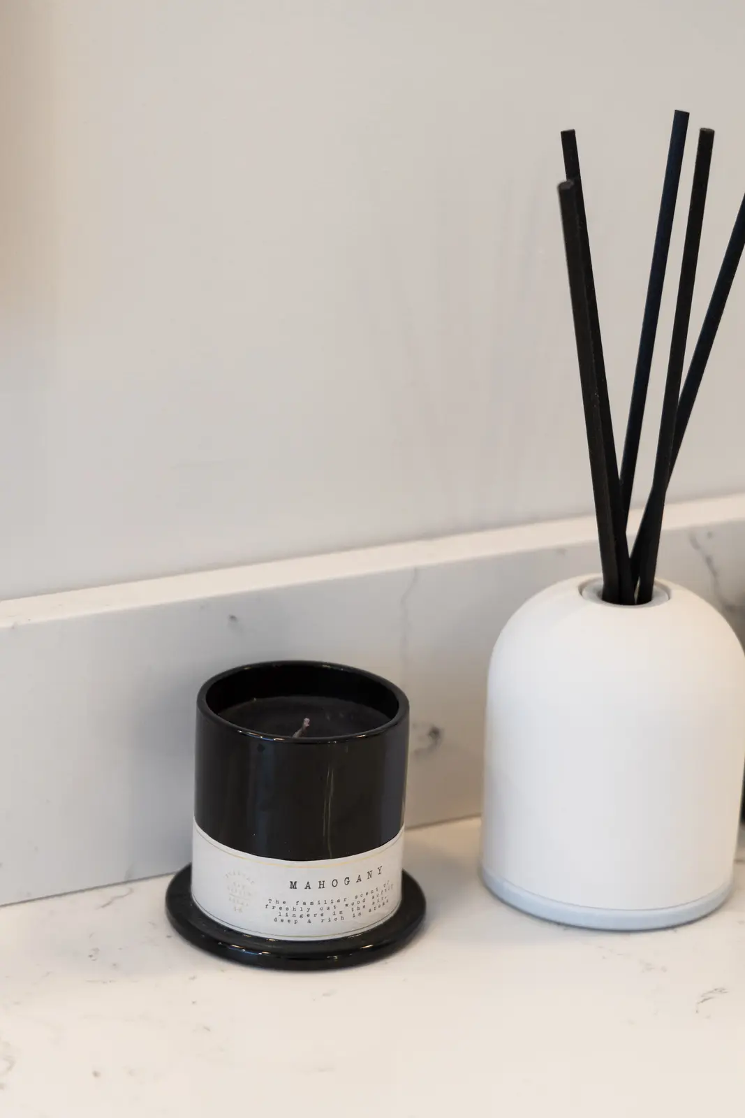 Black and white vessels on the marble vanity in a Richmond Hill townhouse