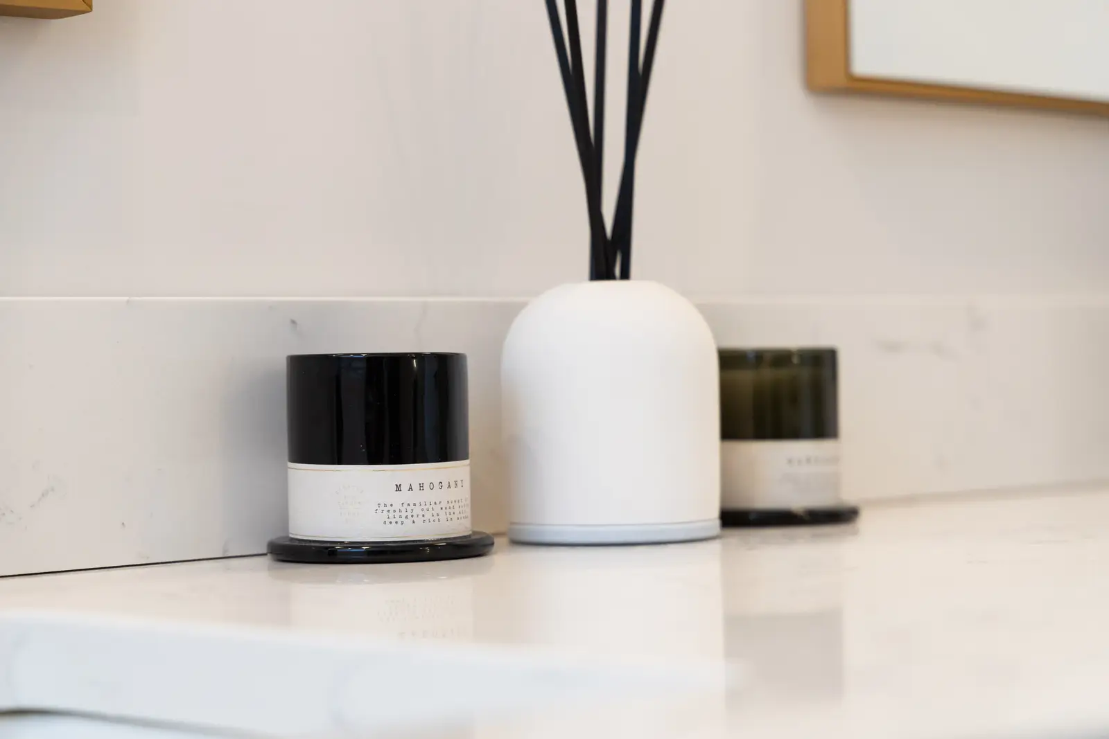 Black and white vessels on the marble bathroom counter in a Richmond Hill townhouse