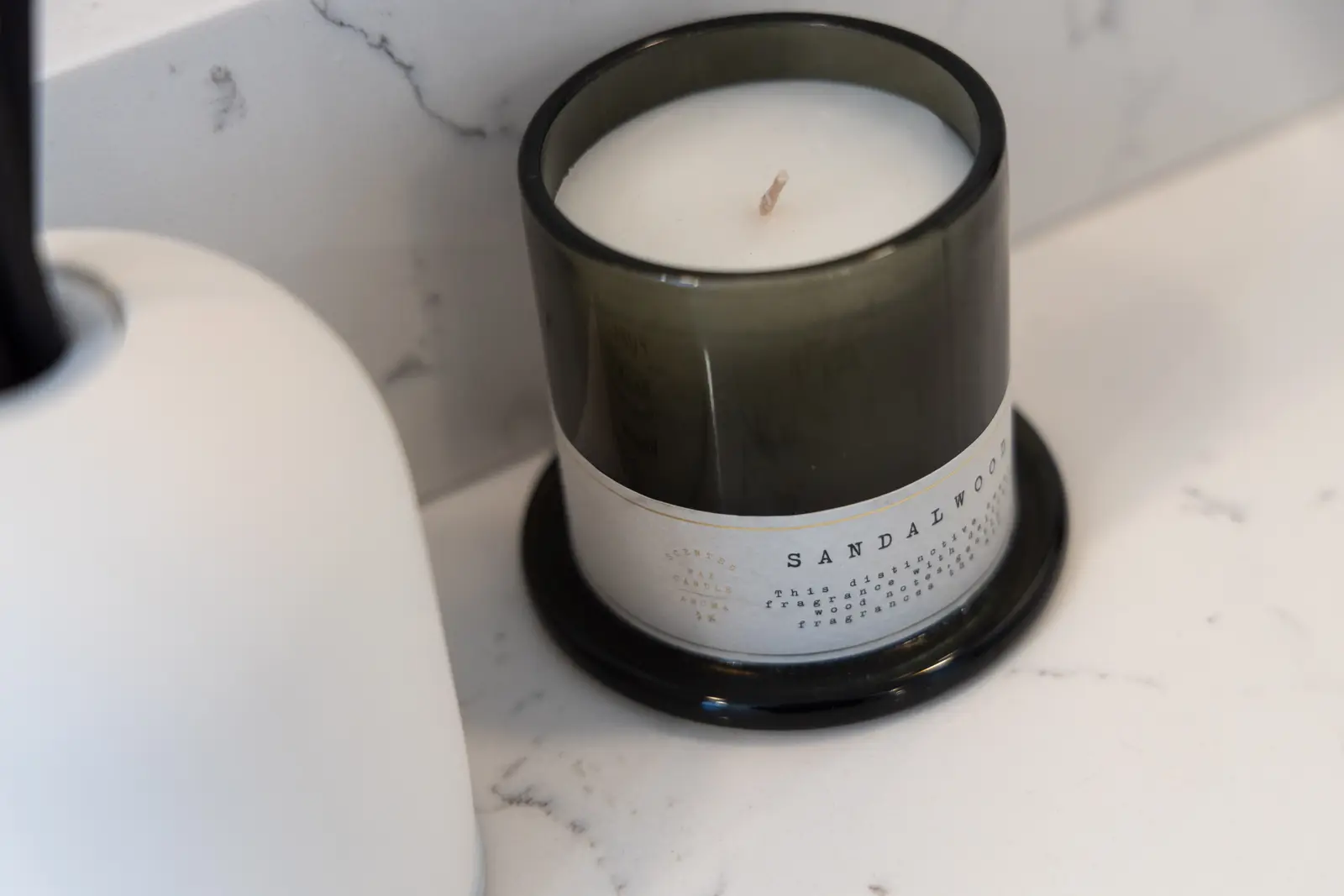 Candle on the marble bathroom counter in a Richmond Hill townhouse