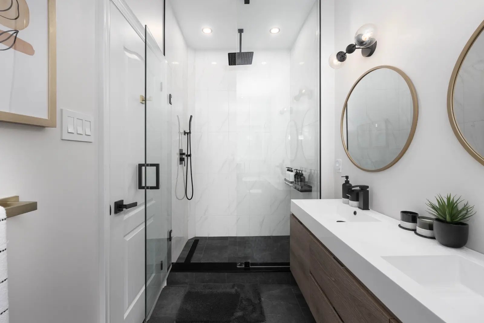 Interior of the Bristlewood Crescent renovation in Vaughan, with white cabinetry, warm wood floors, and black fittings.