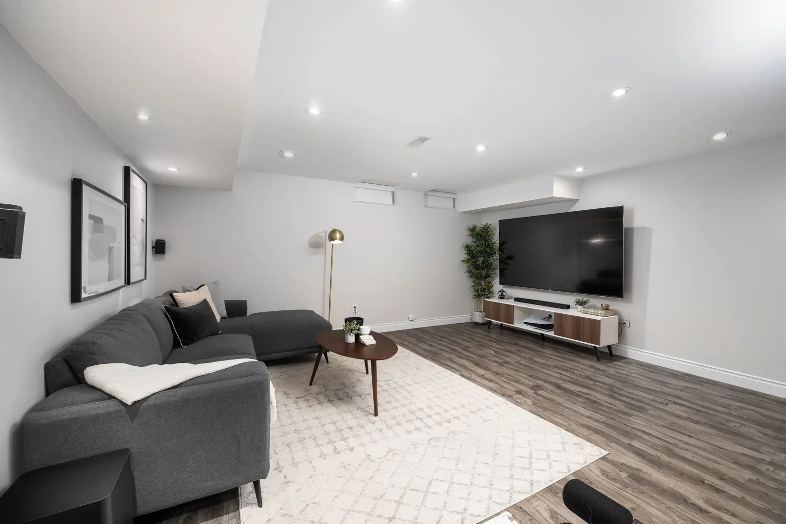 Interior of the Bristlewood Crescent renovation in Vaughan, with white cabinetry, warm wood floors, and black fittings.