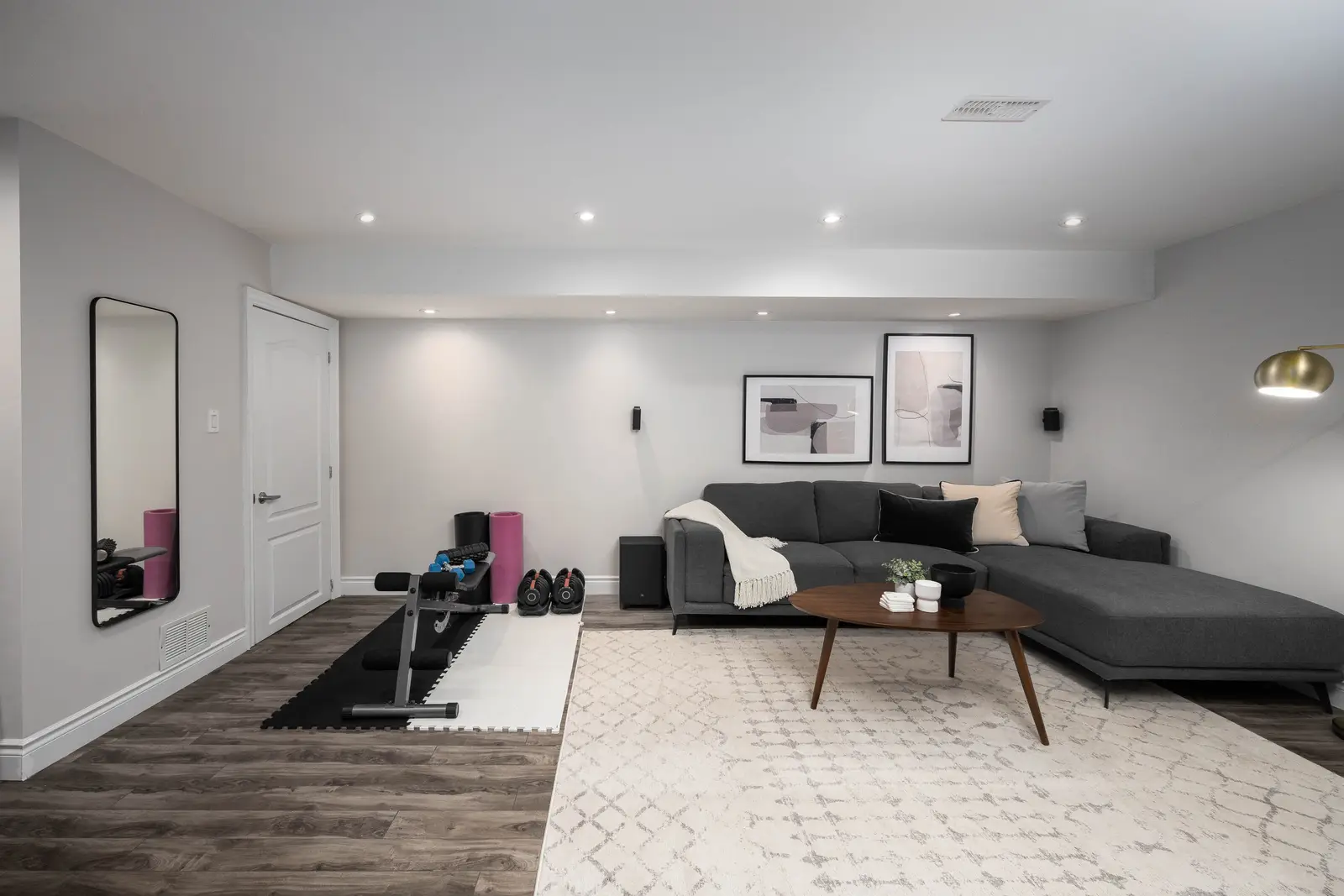 Interior of the Bristlewood Crescent renovation in Vaughan, with white cabinetry, warm wood floors, and black fittings.