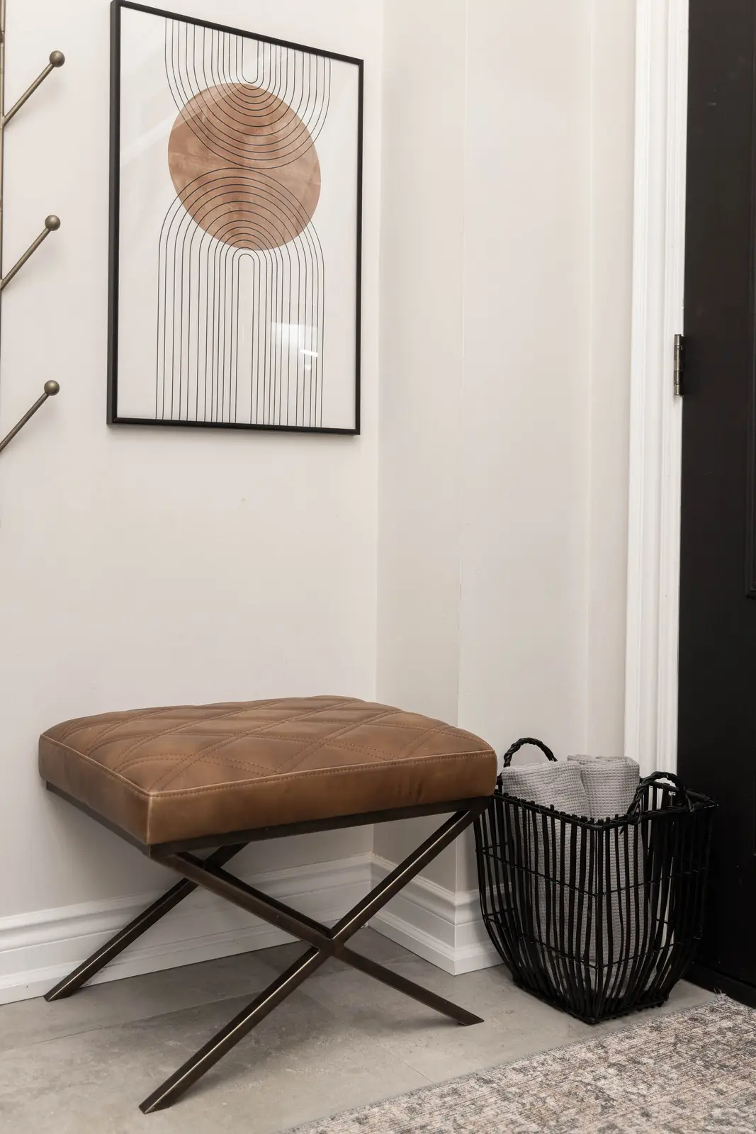 Interior of the Bristlewood Crescent renovation in Vaughan, with white cabinetry, warm wood floors, and black fittings.