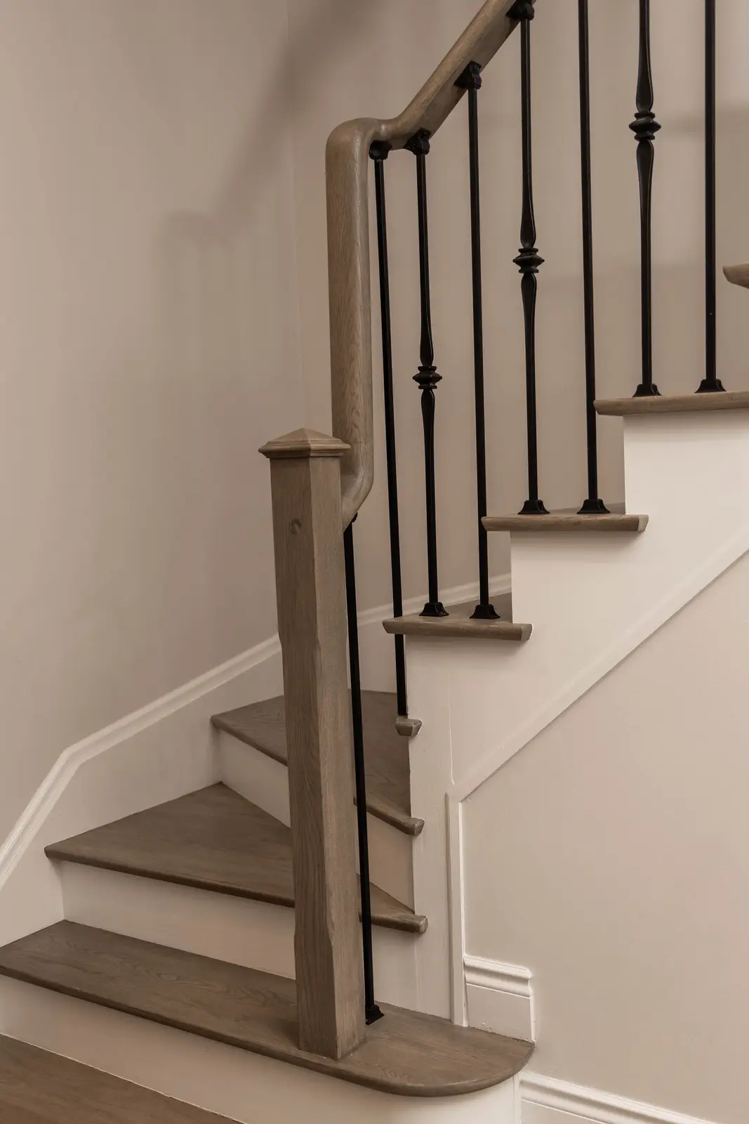 Interior of the Bristlewood Crescent renovation in Vaughan, with white cabinetry, warm wood floors, and black fittings.