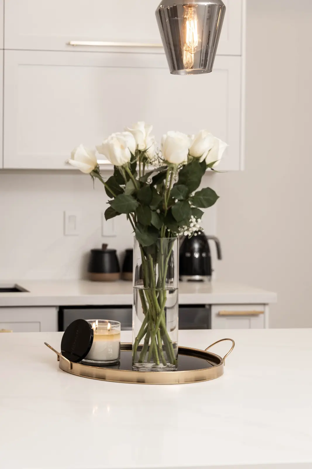 Interior of the Bristlewood Crescent renovation in Vaughan, with white cabinetry, warm wood floors, and black fittings.