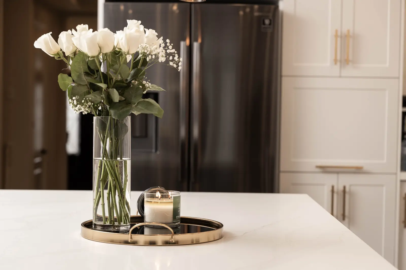 Interior of the Bristlewood Crescent renovation in Vaughan, with white cabinetry, warm wood floors, and black fittings.