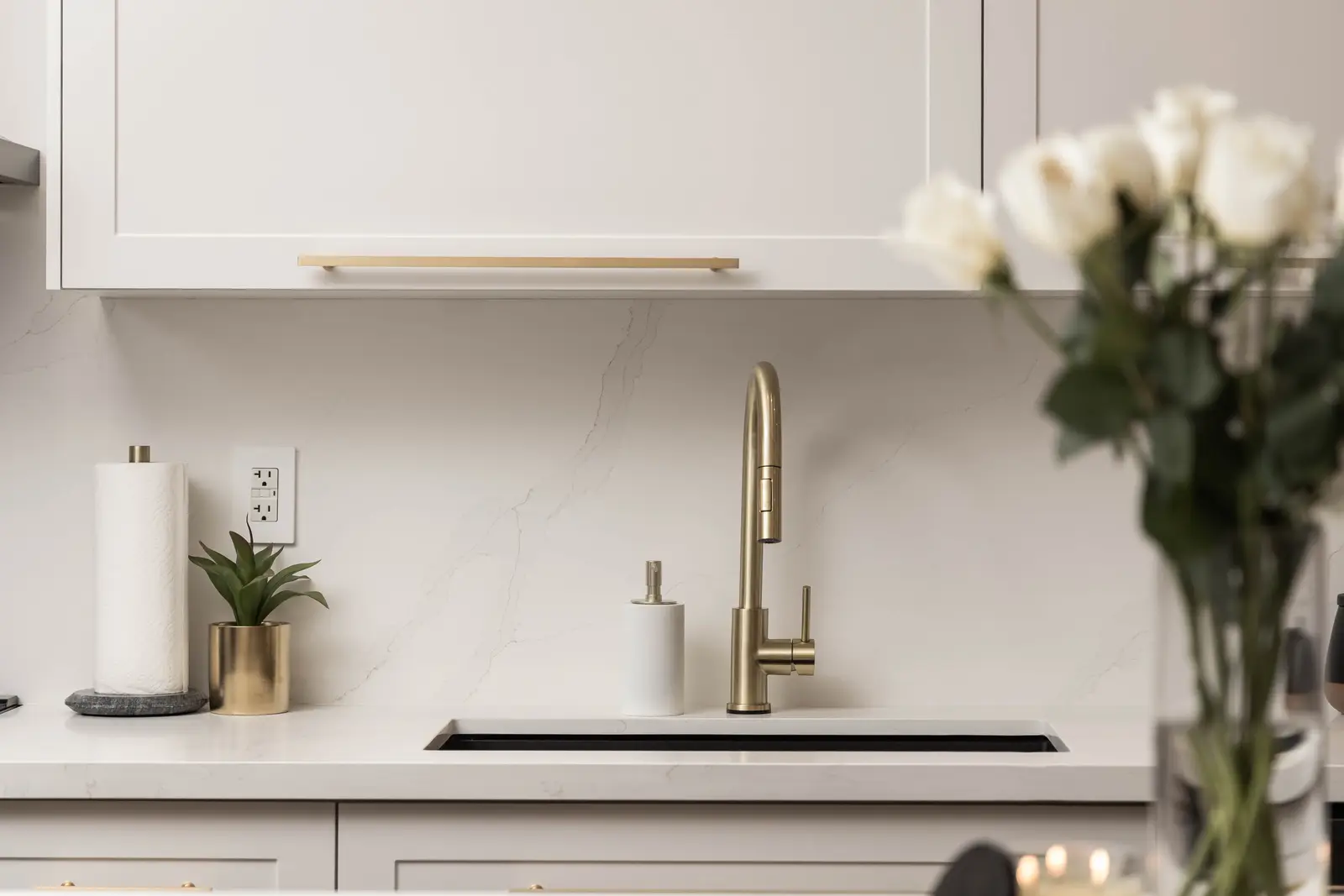 Interior of the Bristlewood Crescent renovation in Vaughan, with white cabinetry, warm wood floors, and black fittings.