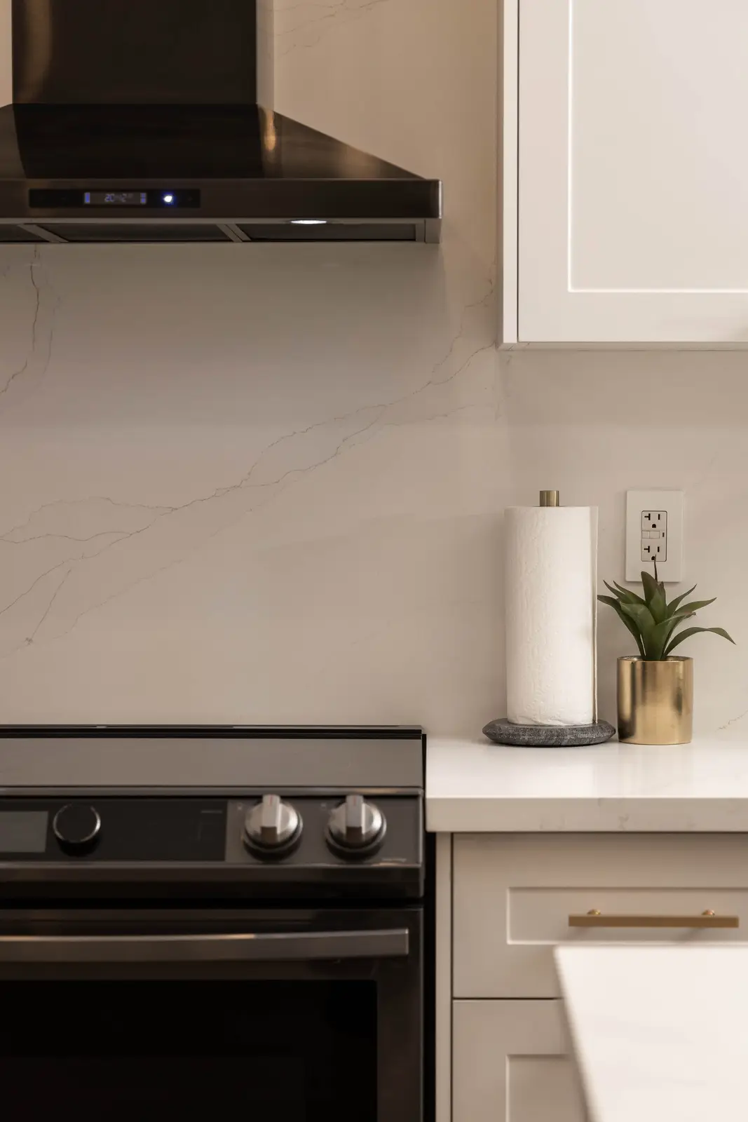 Interior of the Bristlewood Crescent renovation in Vaughan, with white cabinetry, warm wood floors, and black fittings.