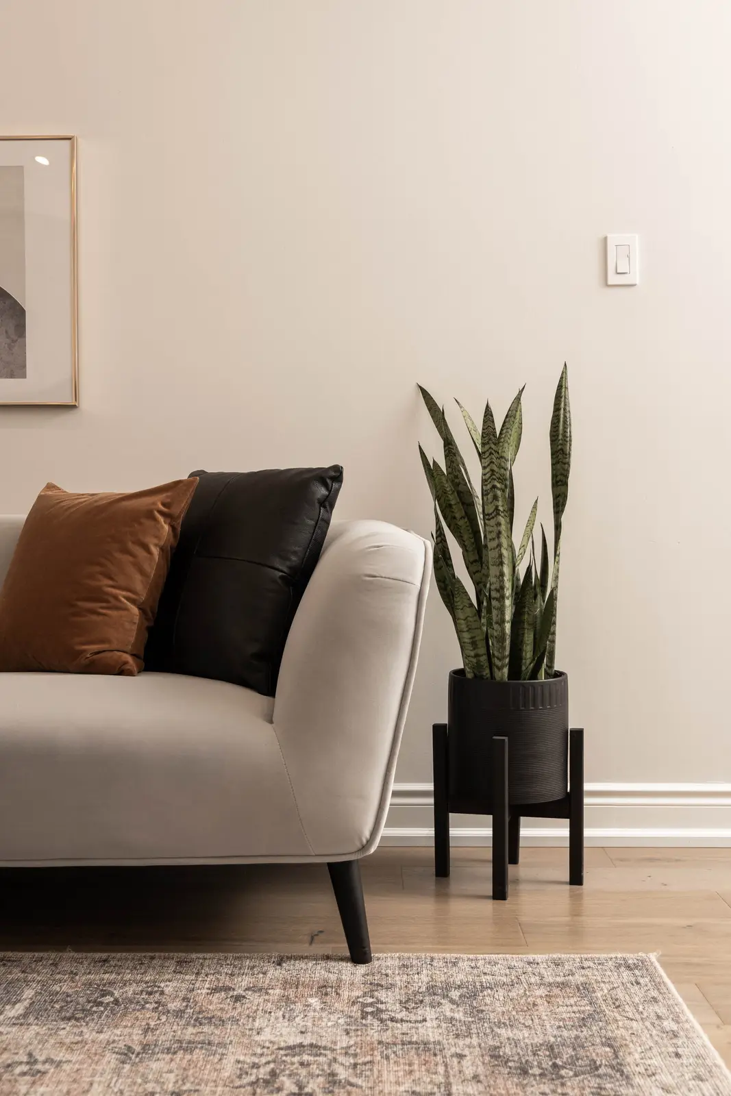 Interior of the Bristlewood Crescent renovation in Vaughan, with white cabinetry, warm wood floors, and black fittings.