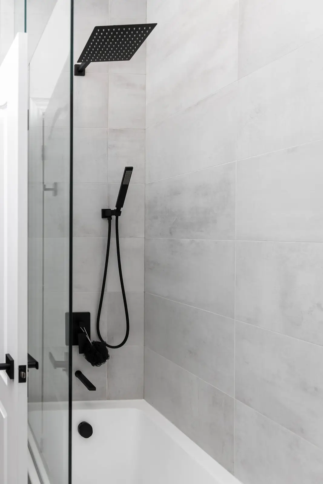 Interior of the Bristlewood Crescent renovation in Vaughan, with white cabinetry, warm wood floors, and black fittings.