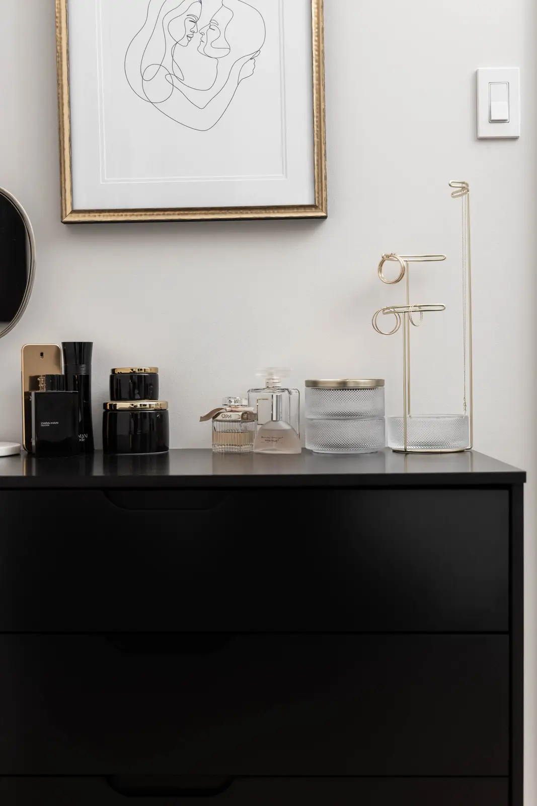 Interior of the Bristlewood Crescent renovation in Vaughan, with white cabinetry, warm wood floors, and black fittings.