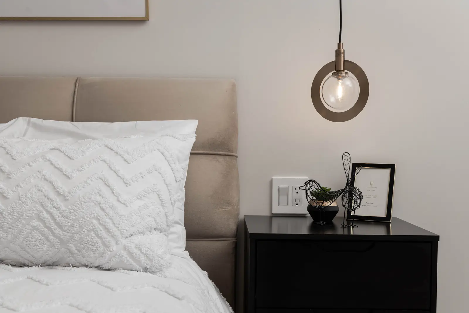 Interior of the Bristlewood Crescent renovation in Vaughan, with white cabinetry, warm wood floors, and black fittings.