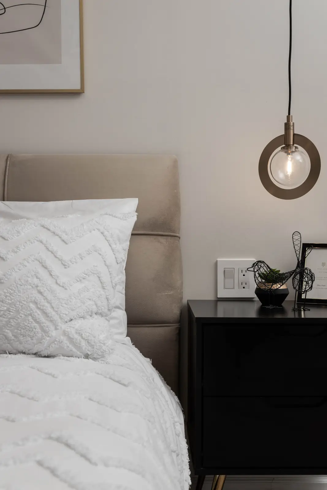 Interior of the Bristlewood Crescent renovation in Vaughan, with white cabinetry, warm wood floors, and black fittings.