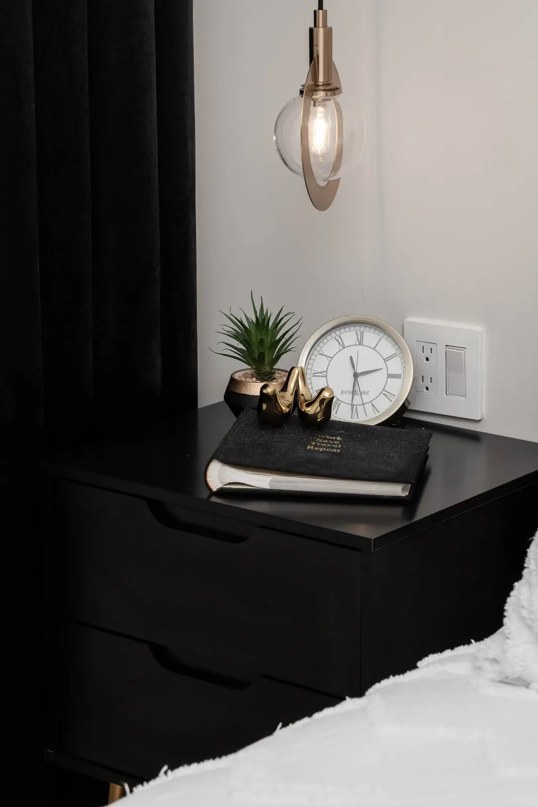 Interior of the Bristlewood Crescent renovation in Vaughan, with white cabinetry, warm wood floors, and black fittings.