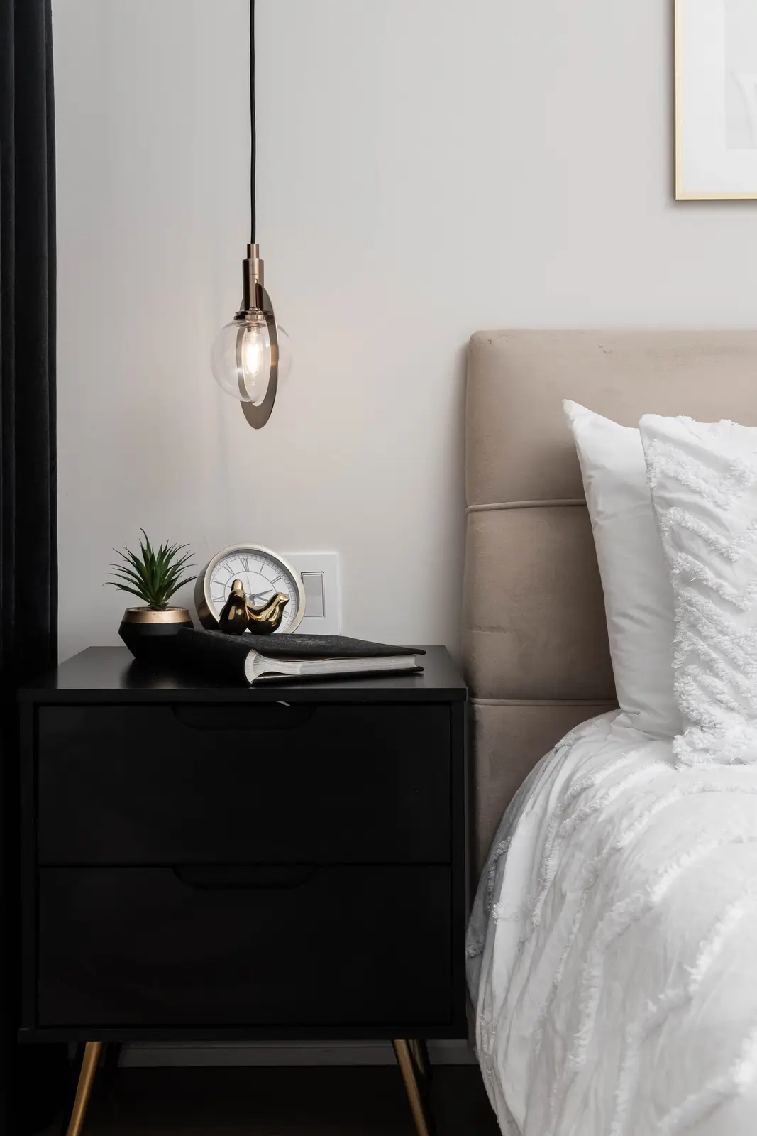 Interior of the Bristlewood Crescent renovation in Vaughan, with white cabinetry, warm wood floors, and black fittings.