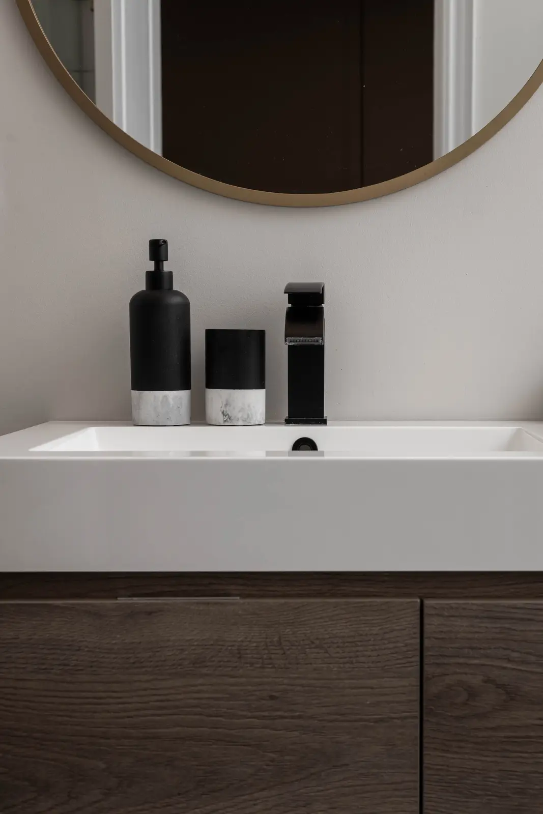 Interior of the Bristlewood Crescent renovation in Vaughan, with white cabinetry, warm wood floors, and black fittings.