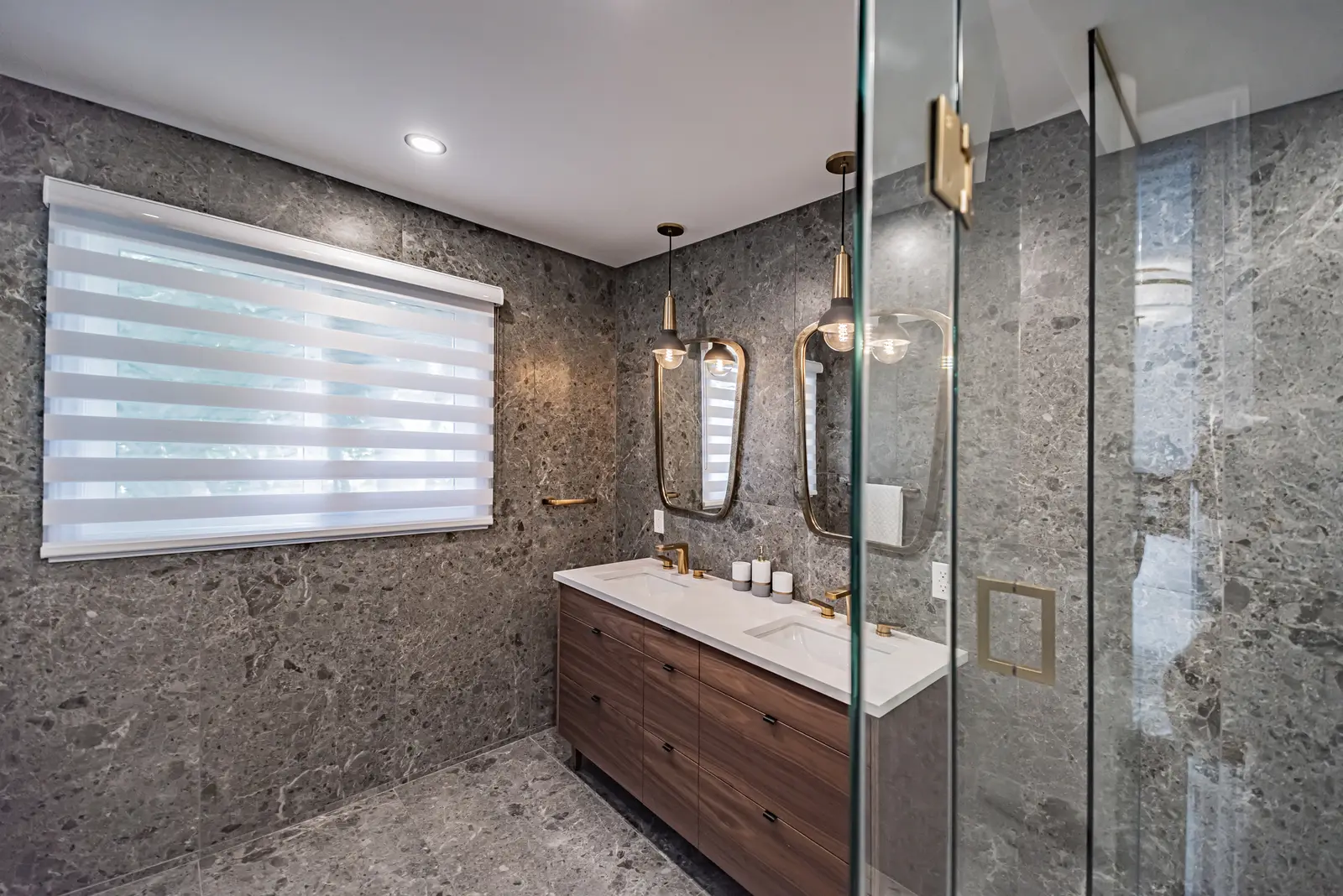 Interior of a Thornhill house renovation, with sage cabinetry, light wood floors, walnut, and brass fittings.