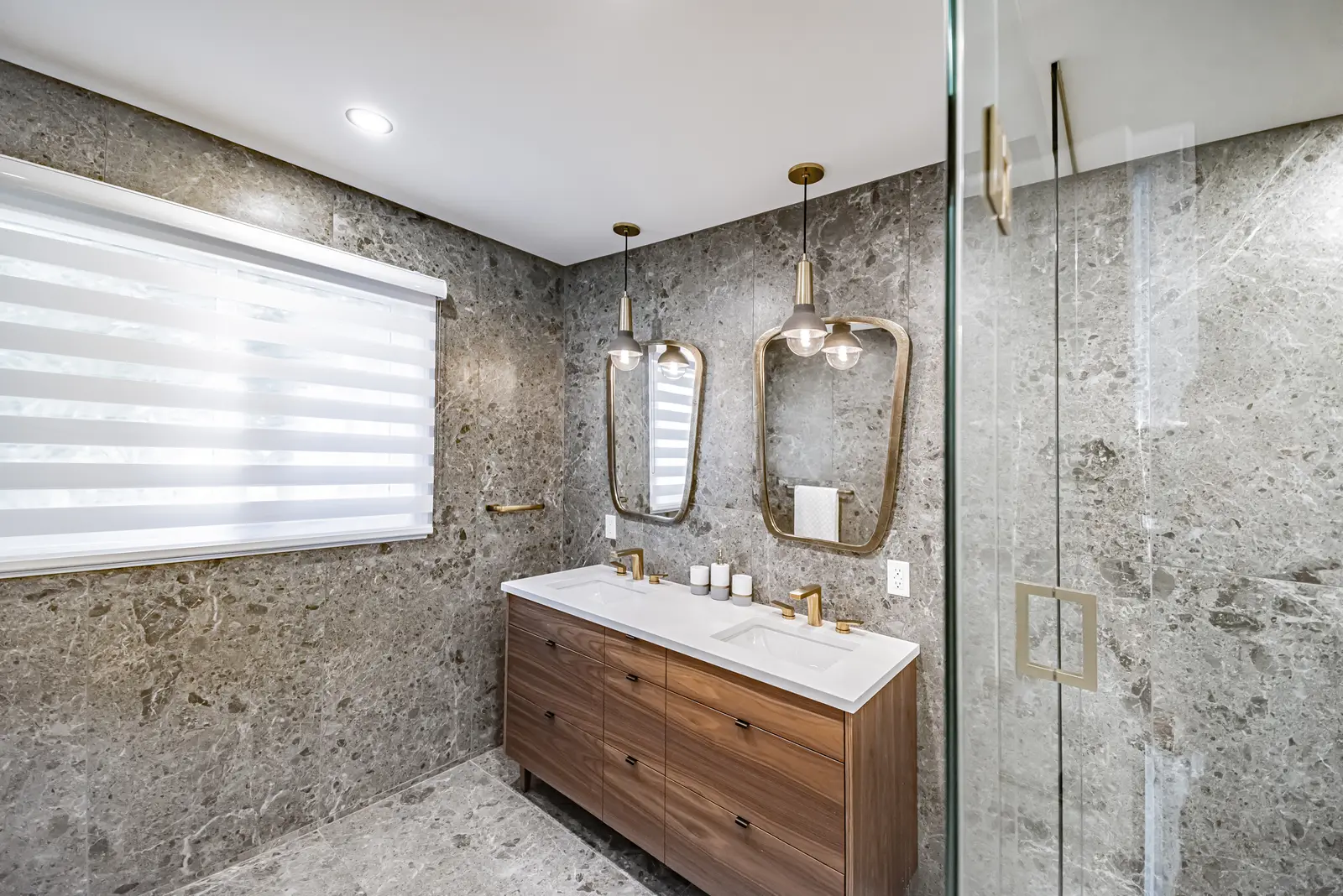 Interior of a Thornhill house renovation, with sage cabinetry, light wood floors, walnut, and brass fittings.