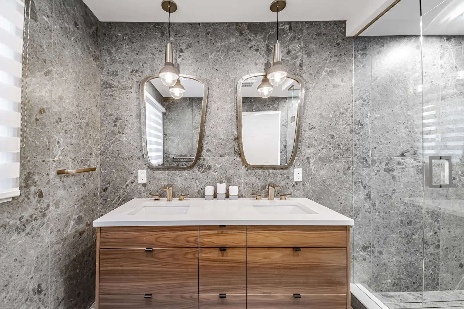 Interior of a Thornhill house renovation, with sage cabinetry, light wood floors, walnut, and brass fittings.