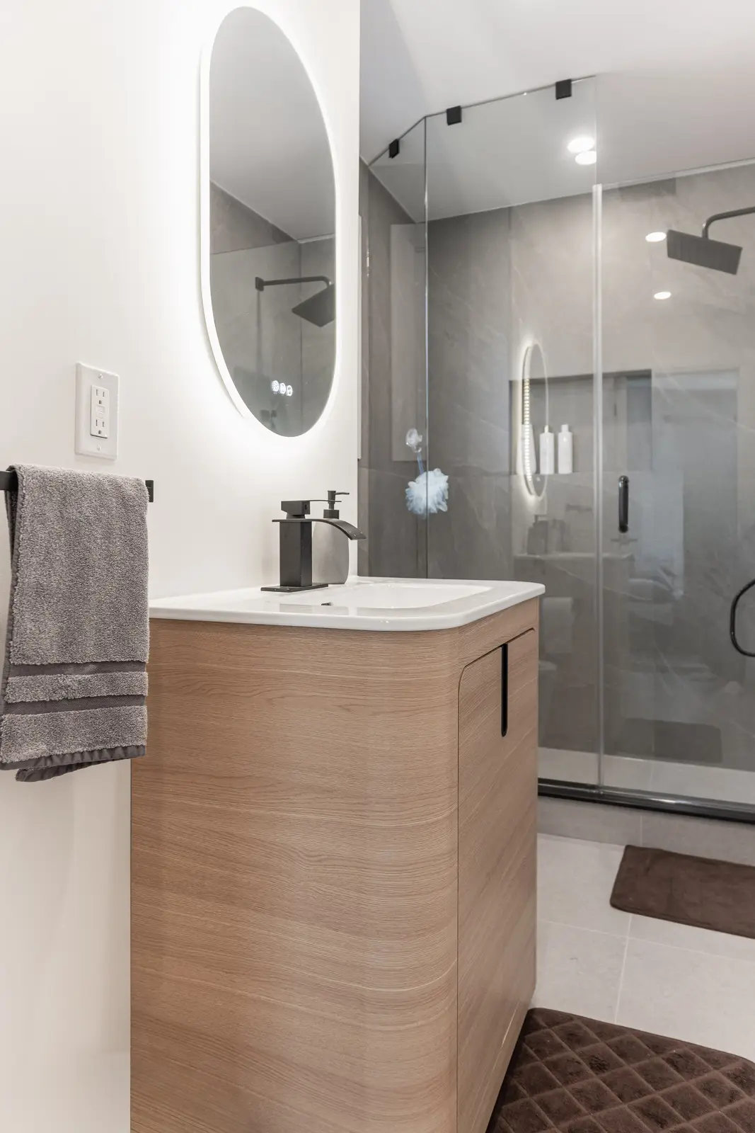 Interior of a Thornhill detached house renovation, with white cabinetry, light oak millwork, and a pale stone counter.