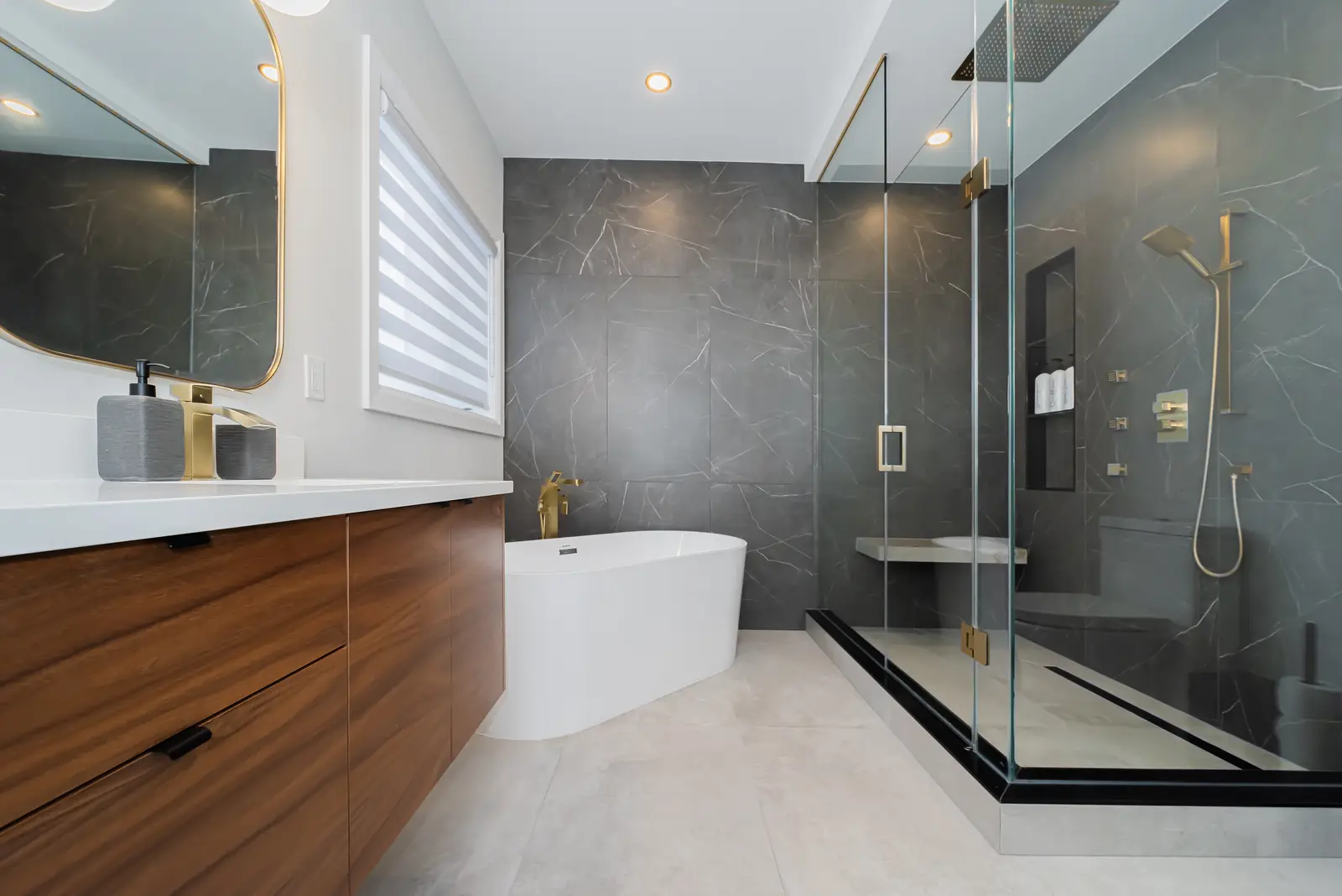 Interior of a Thornhill detached house renovation, with pale wood floors, black furnishings, and a walnut vanity in the primary bathroom.