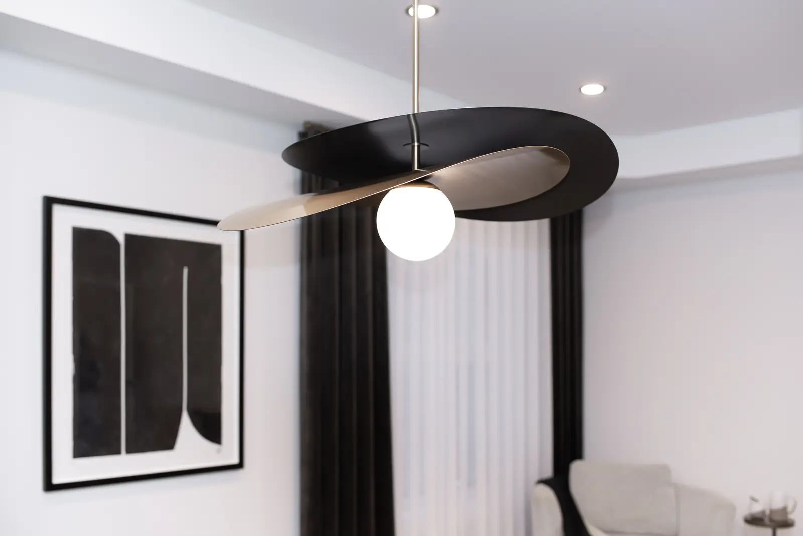 Interior of a Thornhill detached house renovation, with pale wood floors, black furnishings, and a walnut vanity in the primary bathroom.