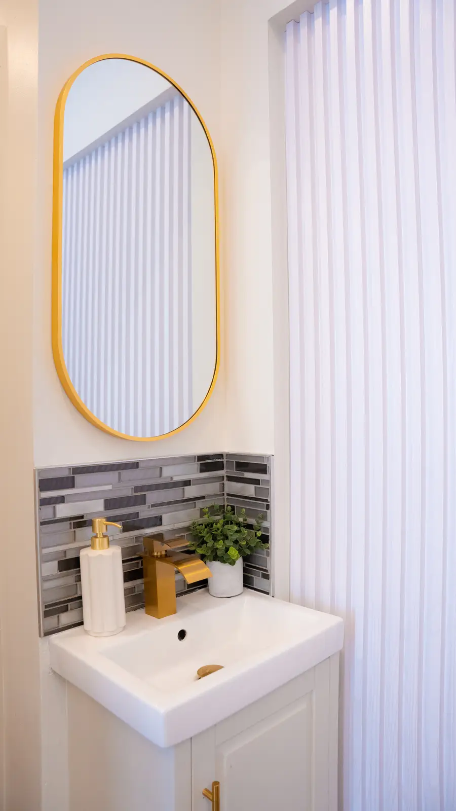 Reception of a Thornhill salon, with a fluted wood desk, a white counter, and a gold Beautique logo.
