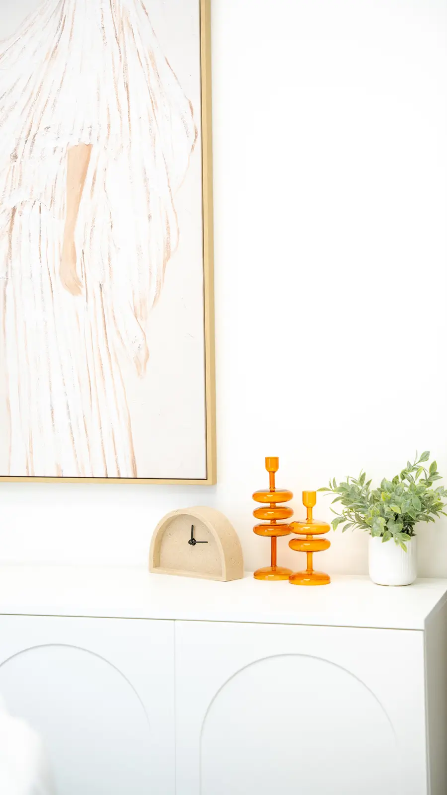 Reception of a Thornhill salon, with a fluted wood desk, a white counter, and a gold Beautique logo.