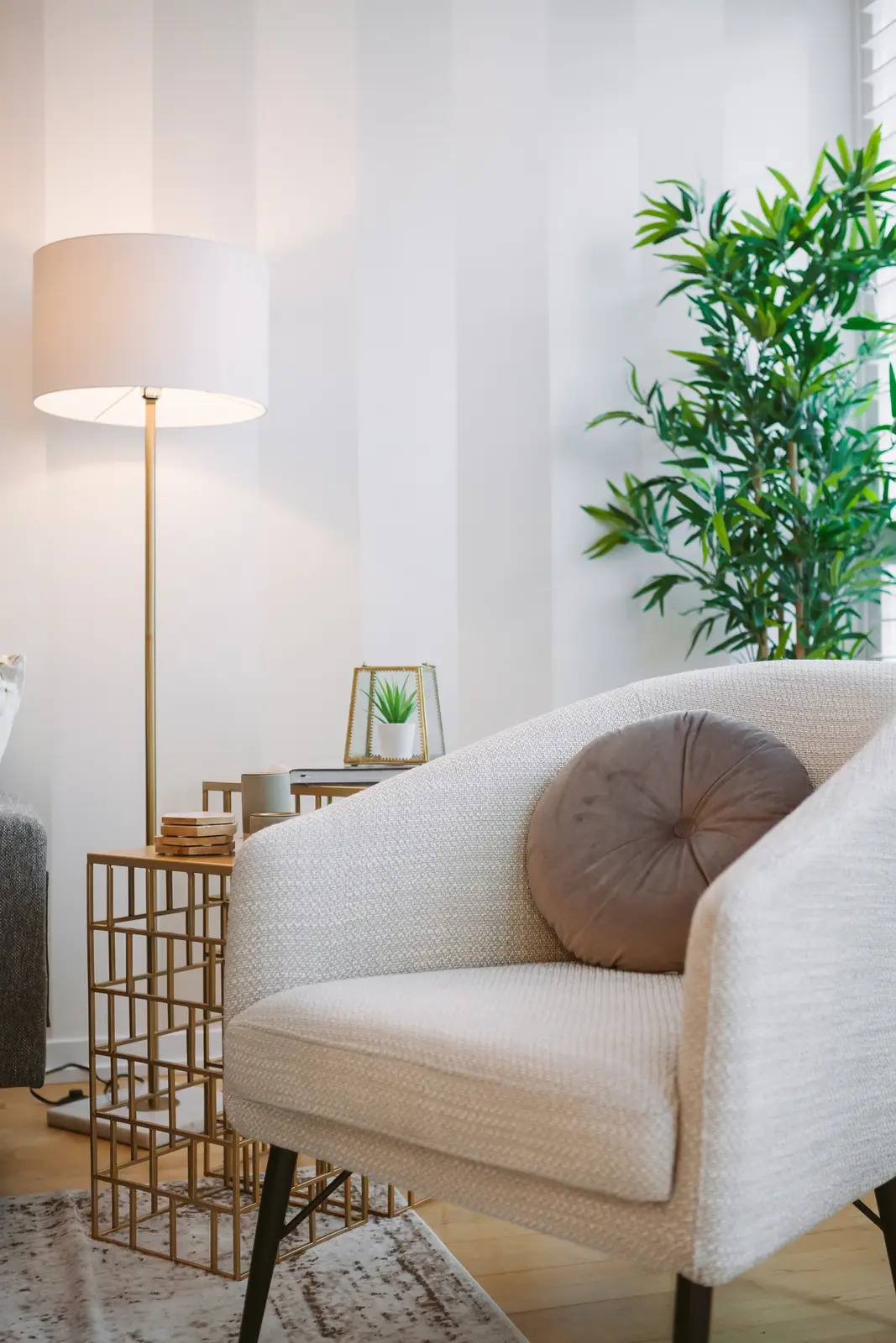 Interior of a downtown Toronto condo, with a wood kitchen, a grey sofa, and a balcony.