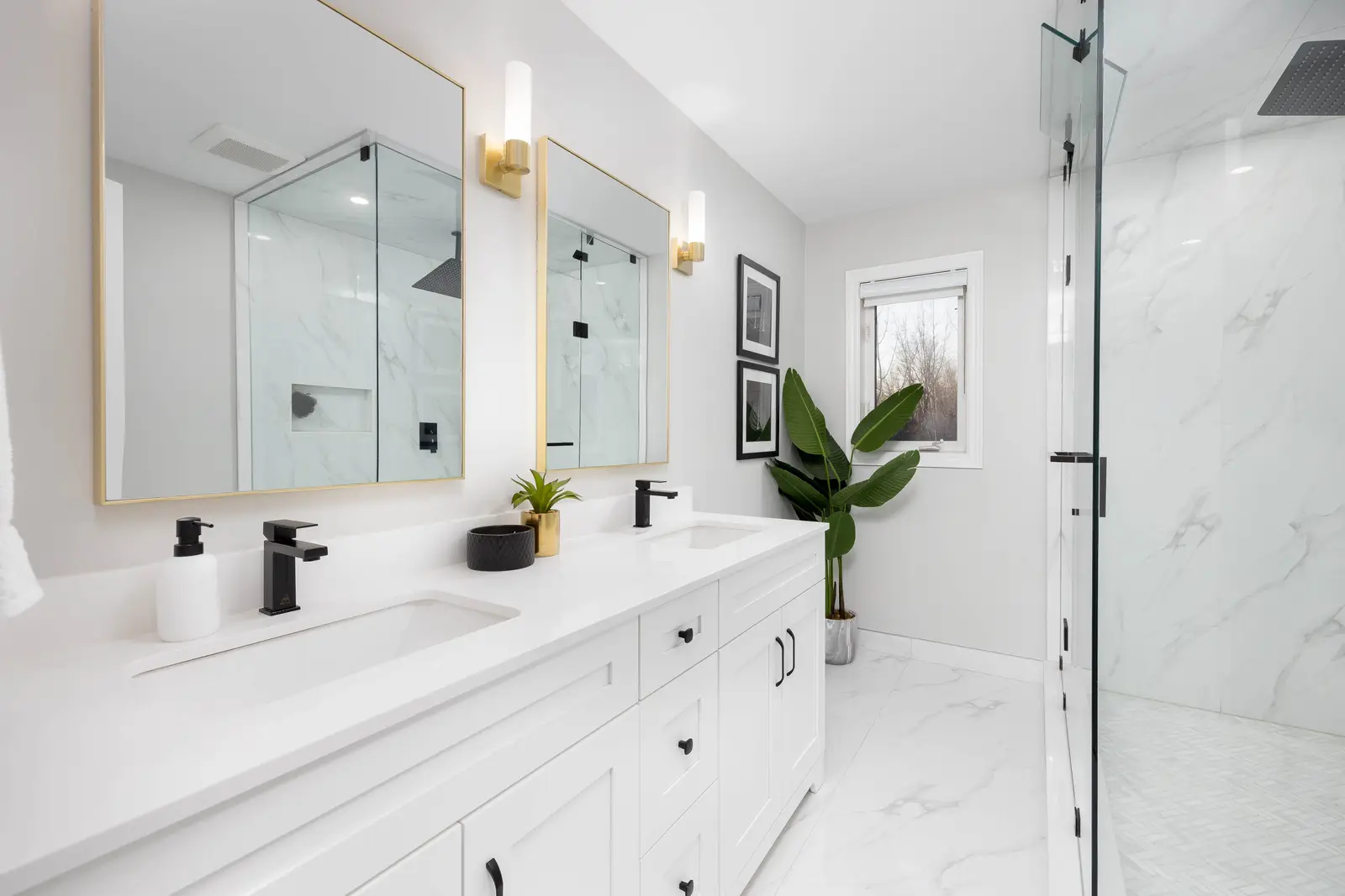 Interior of a Vaughan house, with white cabinetry, dark wood floors, and marble.