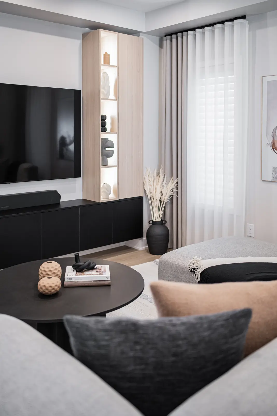 Interior of a house on Disney Court in Whitby, with a light living room, a white kitchen, and a bedroom in dusty rose.